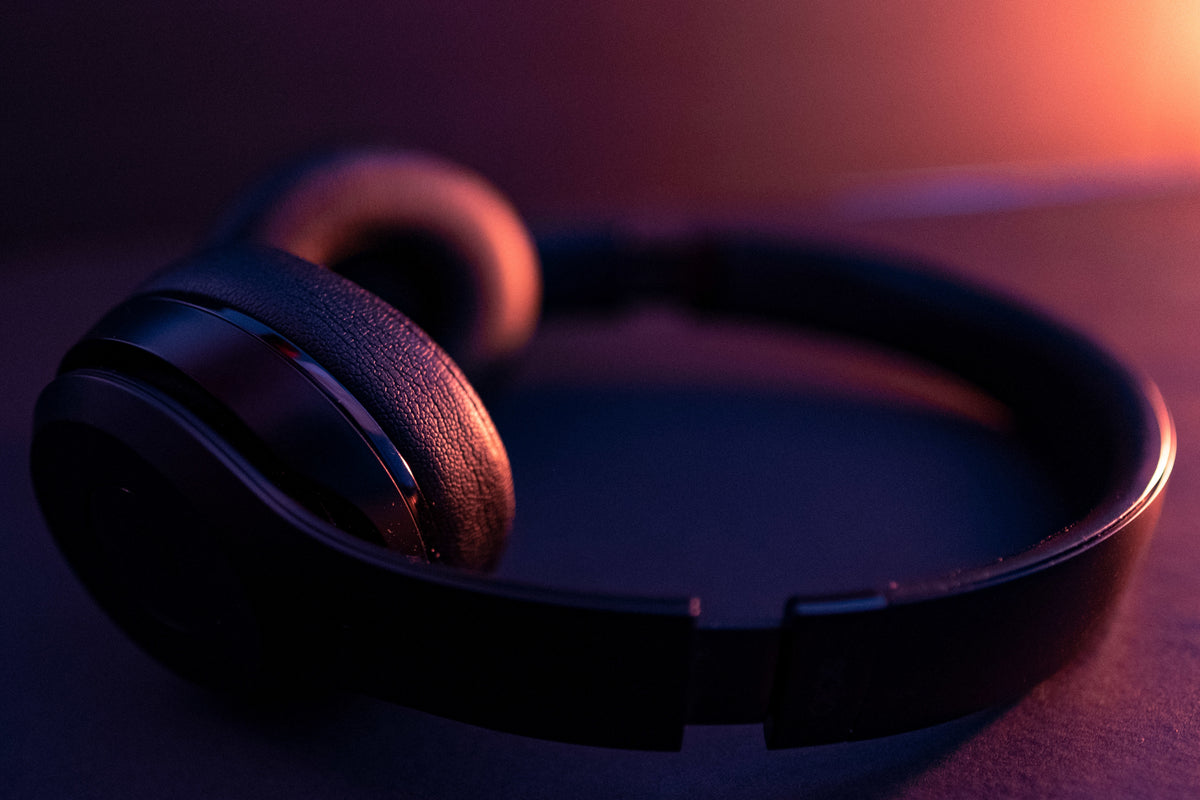 Headphones in warm orange studio light
